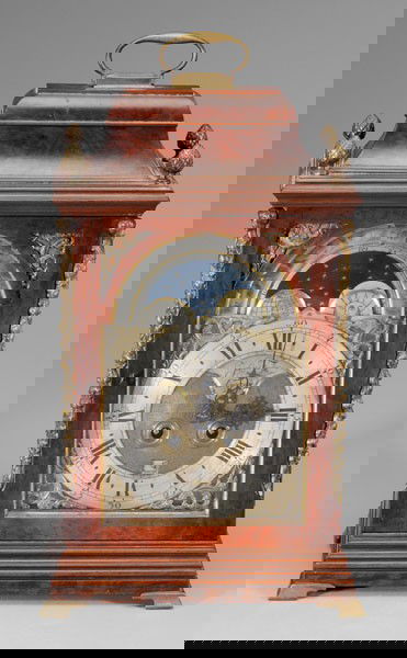 Georgian Bracket Clock, John Taylor: London, 18th century, veneered clock case with chamfered corners, pagoda or sarcophagus top, pierced wood sound frets with floral designs, gilt metal finials and feet, silvered and brass dial plate wi