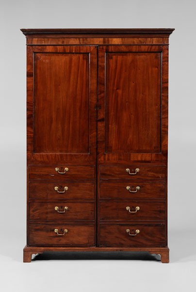 Chippendale Mahogany Armoire: British, 19th century, figured mahogany veneers, removable cornice and frame, two paneled doors each with four false drawer fronts and opening to a shelved interior, paneled backs, possibly original b