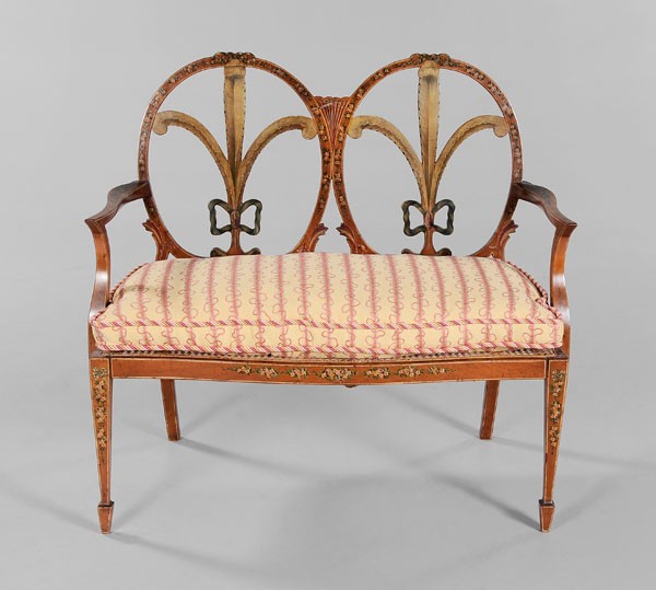Fine Edwardian Settee: British, late 19th century, double chair back settee, mahogany and satinwood(?) in the Sheraton taste with hand-painted Prince of Wales feathers and floral garlands, caned seat with finely upholstered