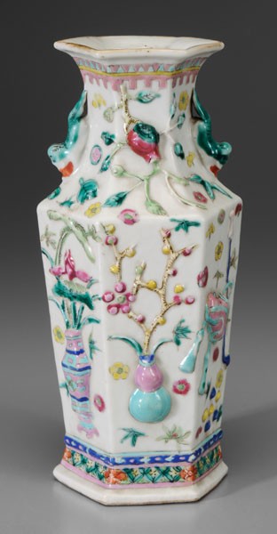 [Famille Rose] Vase: Chinese, late 19th/early 20th century, hexagonal, molded "Hundred Antiques" on a white ground, base with red export seal, 9-1/4 in., with insurance policy for the vase, Beijing, 1984, minor flaws, ver