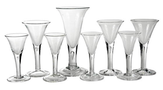 Set of 8 Hand Blown Georgian Style Glass Stems: probably Blenko Glass Company, for Colonial Williamsburg, 20th century, blown trumpet forms with trapped air teardrop in upper stem, four 6-3/8 in. stems; three 7-7/8 in. stems; one 9-3/4 in. stem Pro