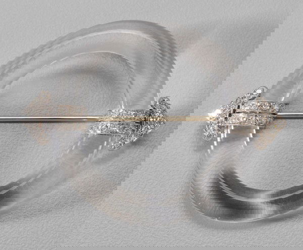 Crystal and Diamond Brooch: 1940-1950, crystal ring accented with 46 round brilliant diamonds, estimated weight 1.0 ct., color F to G, clarity V, platinum mounts, white gold jointed pin stem and clasp, 2-1/8 x 1-5/8 in.; insuran