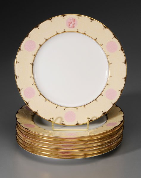 Set of Eight Coalport Plates: English, 20th century, pale yellow rims with raised roundels and profiles of mythological Greek figures, labeled verso Juno, Niobe, Jupiter, Venus, Minerva, Olympia, Hebe, and Alexander, marks for Coa