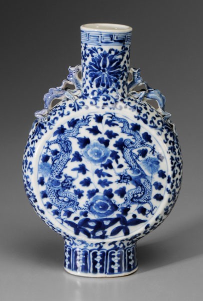 Blue-and-White Porcelain Moon Flask: Chinese, 19th century, circular with convex centers, dragon handles, central dragons on a floral ground, lotus and vine borders, 11-7/8 in., repair to one dragon, minor fritting
