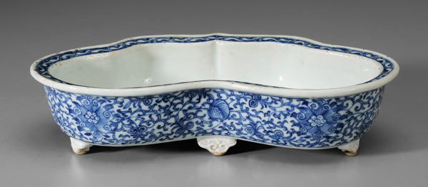 Blue-and-White Porcelain Planter: Chinese, 19th century, narcissus planter, flat rim with leafy vine border, sides with lotuses on a leafy vine ground, five scroll-form feet, 2-3/8 x 9-1/2 x 5-3/4 in., with fabric-covered box, minor f
