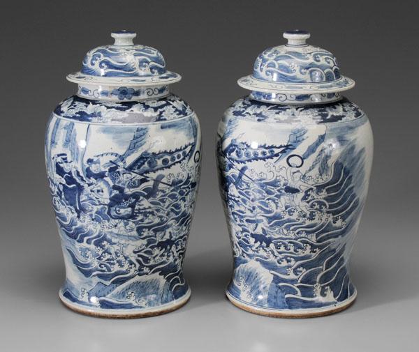 Pair Porcelain Lidded Jars: Chinese, 20th century, blue and white, battle between Nezha and the Dragon Kings, red export seals in lid interiors, 17-1/2 in., firing flaws, minor abrasions and scratches