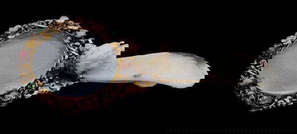 Jade Belt Hook: Chinese, 19th century, grayish-white jade belt hook mounted to gilt brass circular frame set with semi-precious stones (some with drilled holes), holding prong-set glass, molded symbols of The Eight I