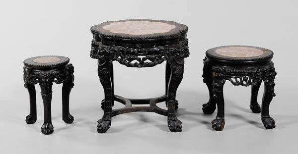 Three Inlaid Tabourets: Chinese, early to mid 20th century, carved and stained wood with inset mottled pink stone, beaded borders, one with scalloped top, fish and water weed skirts, bats with peaches at legs, 17-3/4 in., [m