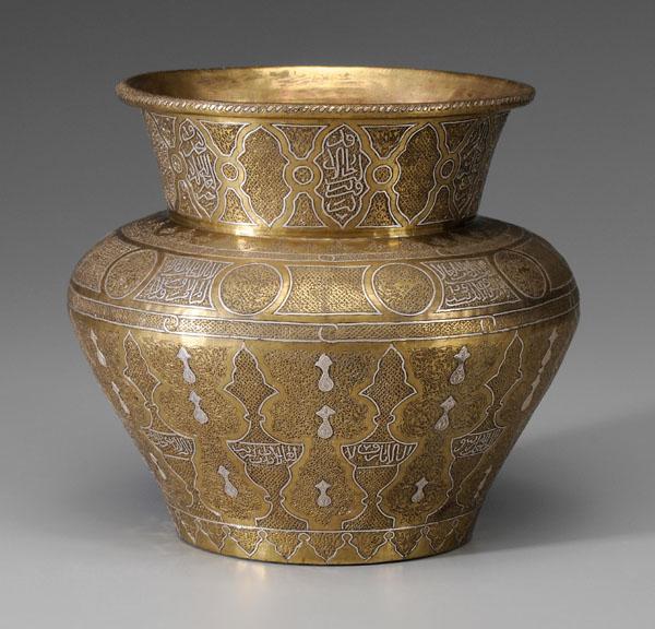 Islamic Silver Inlay Brass Vase: Egyptian or Syrian, late 19th/early 20th century, baluster form, Mamluk Revival or Cairowave, elaborately engraved arabesque patterns within shaped cartouches, several with silver-inlaid script, base 