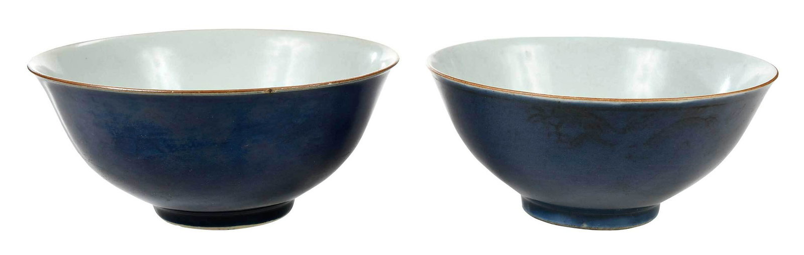 Pair of Chinese Blue Glazed Footed Porcelain Bowls: probably late Qing dynasty, each covered in dark blue glaze, character mark to base, one with remnants of gilt dragon and cloud decoration and character mark above foot, 3 x 6-3/4 in. and 3 x 6-5/8 in