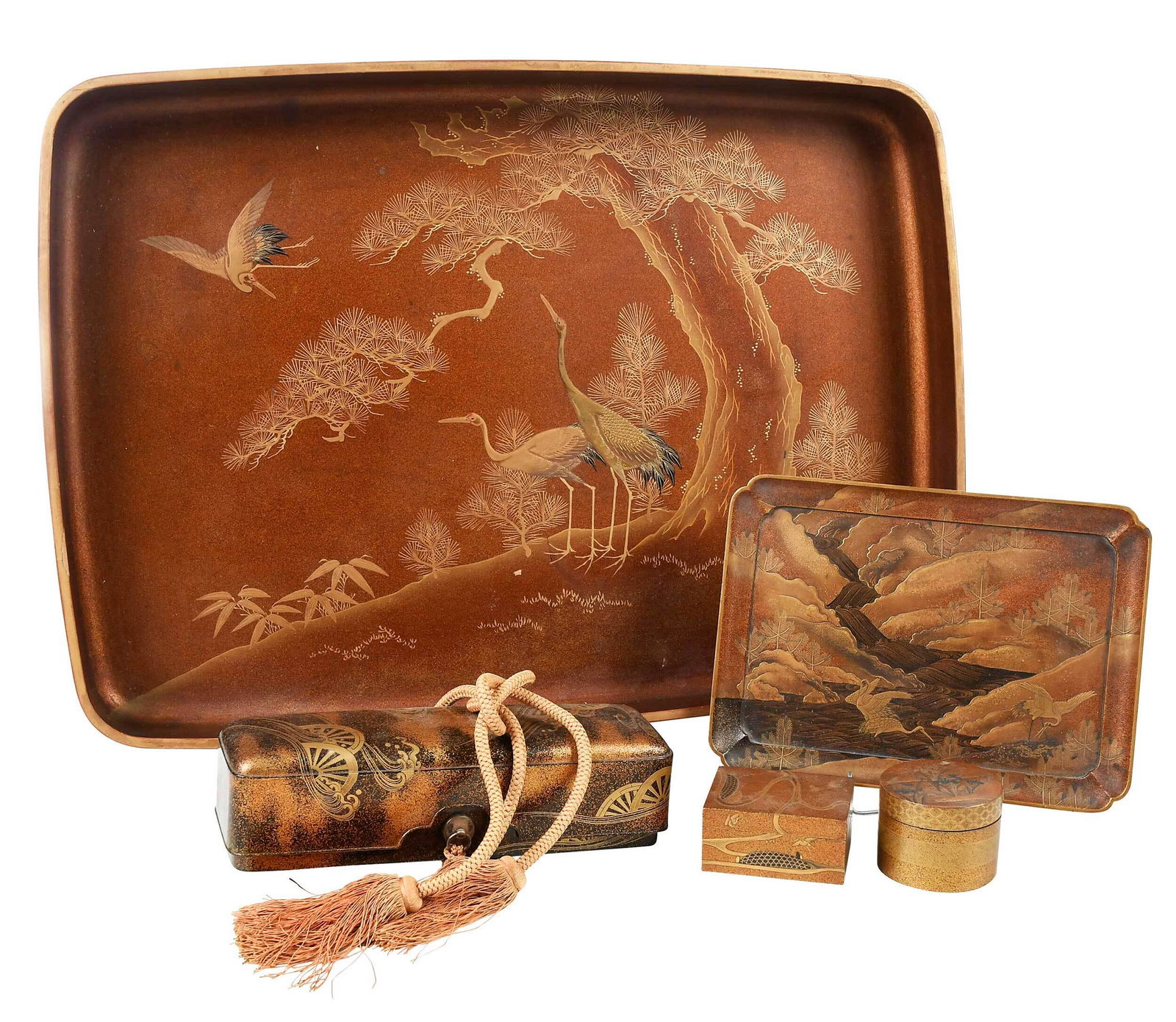 Five Japanese Maki-e Lacquerware Trays and Boxes: probably Edo period, large tray decorated with crane under a tree, 21-1/2x 15-1/2 in.; small tray, mountainous river landscape with wading crane, 9-5/8 x 7 in.; small square box; small round box; fuba