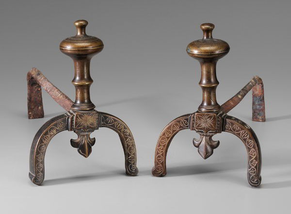 Pair Brass Andirons: possibly Middle Eastern, 19th century, wrought iron billet bars, brass stops with compressed ovoid tops on banded and waisted shafts over U-shaped legs with spearhead drop and etched leafy vines, 9-1/