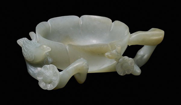 Jade Brush Washer: Qing Dynasty, medium grayish-green, flowering prunus branches with perching magpie supporting one large translucent blossom forming reservoir, 4 in., excellent condition Provenance: Mandarin Hotel, Ho