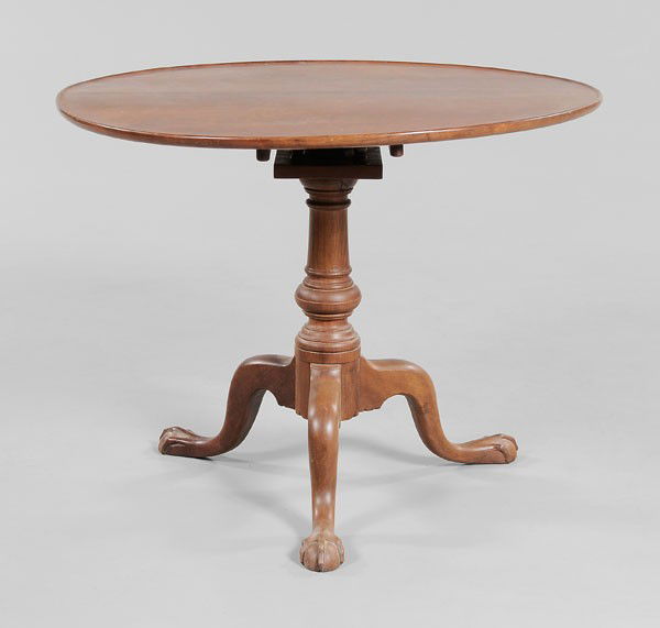 Chippendale Tilt-Top Tea Table: Pennsylvania, 18th century, dished two-board figured top, compressed-ball support and ball-and-claw feet, 27-1/2 x 35-1/2 x 34-1/4 in., refinished, battens probably replaced, restorations to birdcage,