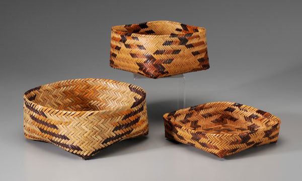 Three Cherokee River Cane Baskets: North Carolina, mid 20th century, one double woven, 4-5/8 x 10-3/4 in., [excellent condition;] one finely double woven, 4-3/4 x 8-1/4 in., [excellent condition;] one single-woven tray, bottom initiale
