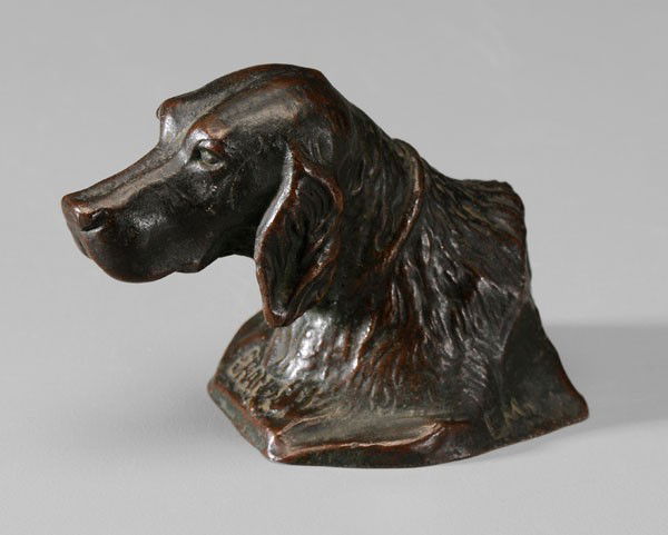 Tiffany Studios: (early 20th century), portrait bust of a dog titled "Shando", incised initials "EM", stamped on underside "Tiffany Studios New York 889", [verdigris] patinated bronze, 2-1/2 x 3-1/4 x 2 in., abrasions
