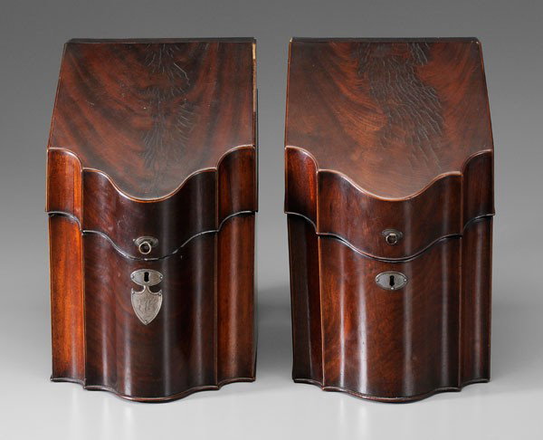 Near Pair George III Knife Boxes, 1791: British, late 18th century, each of figured mahogany with shaped front, light and dark string inlay at borders, unmatched silver and silver plate escutcheons and lid pulls, silver shield-shaped escutc