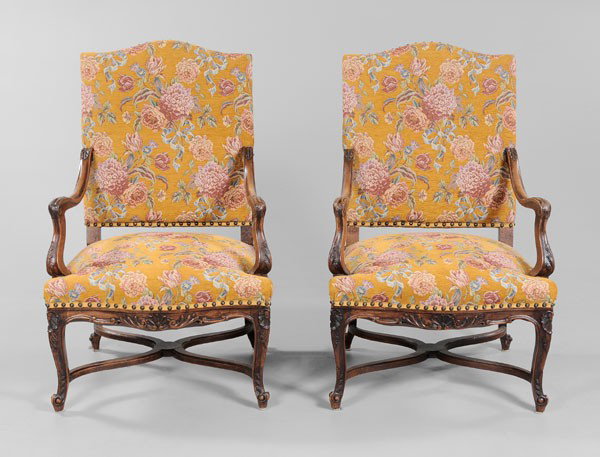 Pair Provincial Louis XV Style: Open-Arm Chairs, French or Italian, late 19th century, finely carved walnut frames with cross-stretchers, tapestry style upholstery with brass tacks, 43-1/2 x 27-1/2 x 24 in., good condition overall, 