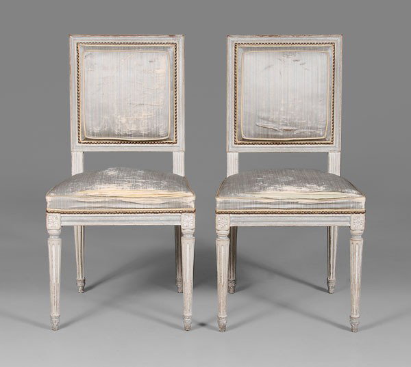 Pair Louis XVI Style Paint-Decorated: Side Chairs, French, late 19th/early 20th century, each with carved beechwood frames with putty and pale blue paint decoration, original blue silk upholstery with brass tacks, 36 x 18-1/2 x 18 in., go