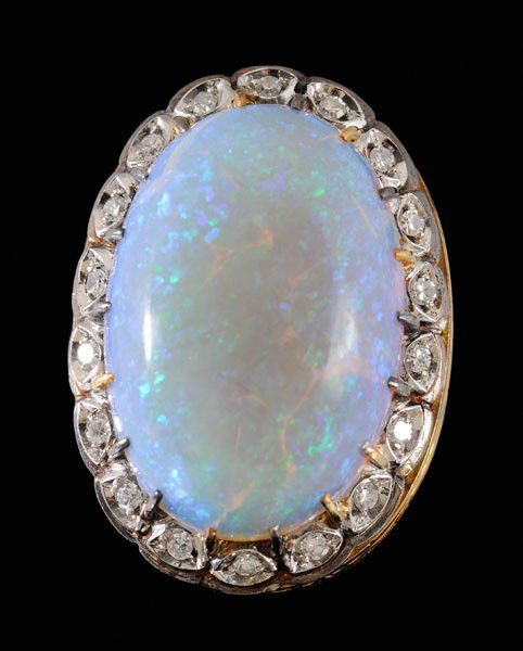 Opal and Diamond Ring: central oval cabochon semi-crystal opal, estimated weight 21.76 cts., surrounded by 18 single-cut diamonds, total estimated weight .20 cts., 18 kt. yellow and white gold mount engraved with [fleur-de-