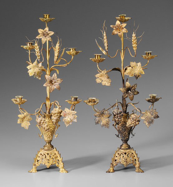 Pair Gilt Metal Candelabra: early 20th century, each with five lights and clusters of grapes below heads of wheat, tripod hoof feet, 25-1/2 in., wear and losses to gilding Provenance: Private Collection, Tennessee