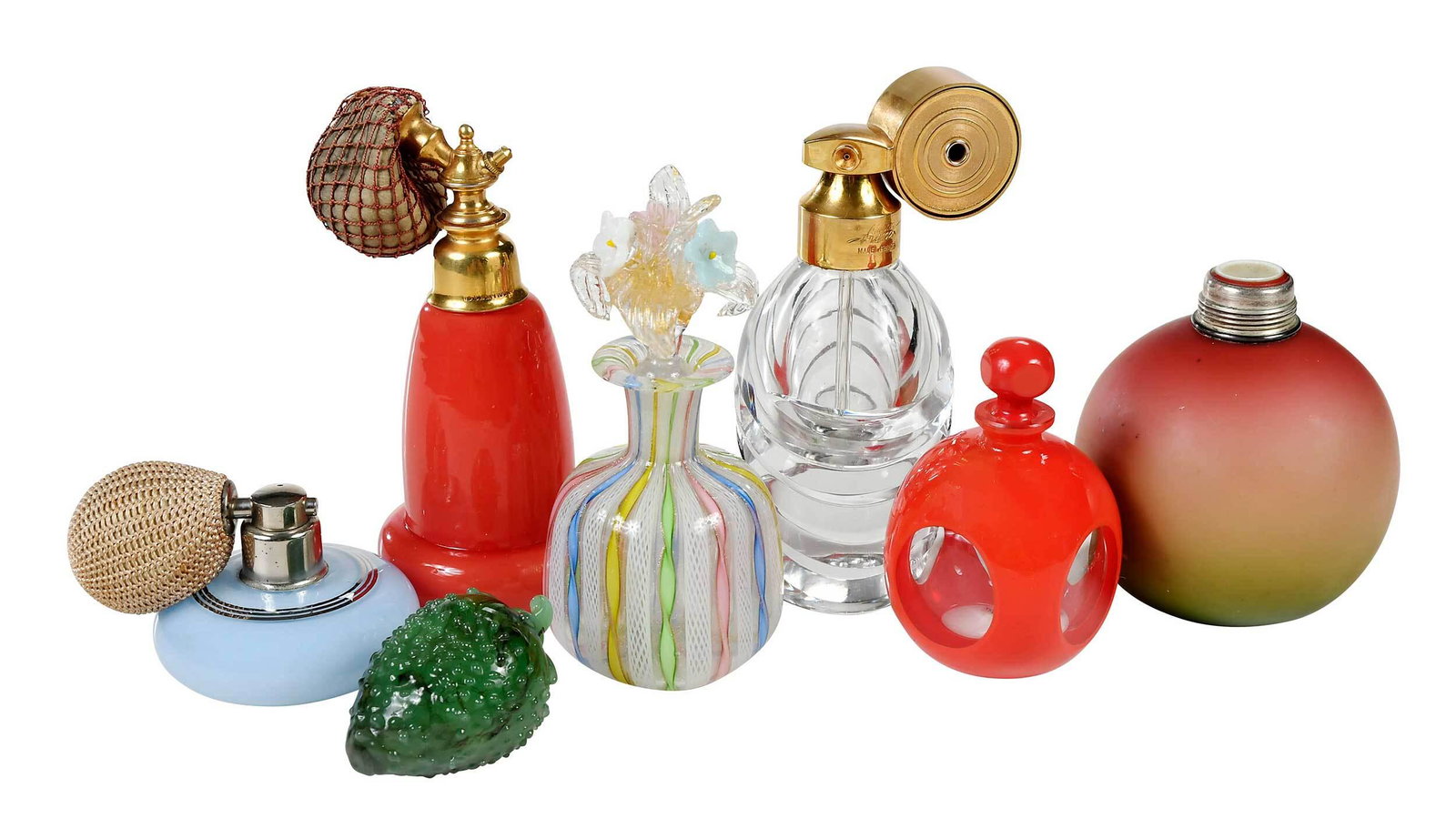 Seven Glass and Hardstone Perfumes and Atomizers: late 19th/20th century, swirl clear glass bottle, brass atomizer hardware, marked "Marcel Franck/Made in France", bottle possibly Baccarat, 5-1/8 in.; coral cylindrical form, circular base, brass hard