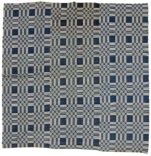 Three-panel overshot coverlet,: blue and white geometric designs, pest damage, selvedge with some wear and fraying, 96 x 99"