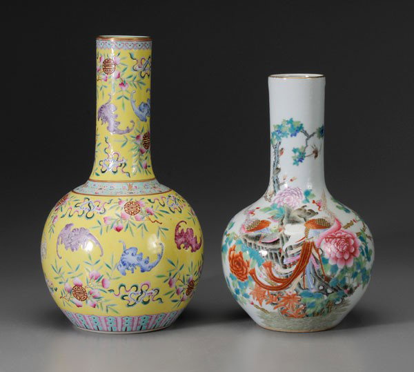 Two Porcelain Bottle Vases: Chinese: one with bats, peaches, [ruyi] scepters, [shou] symbols scattered on a yellow ground, 20th century, 14-3/4 in., [excellent condition;] one with phoenixes, cranes perched on rock formation, mo