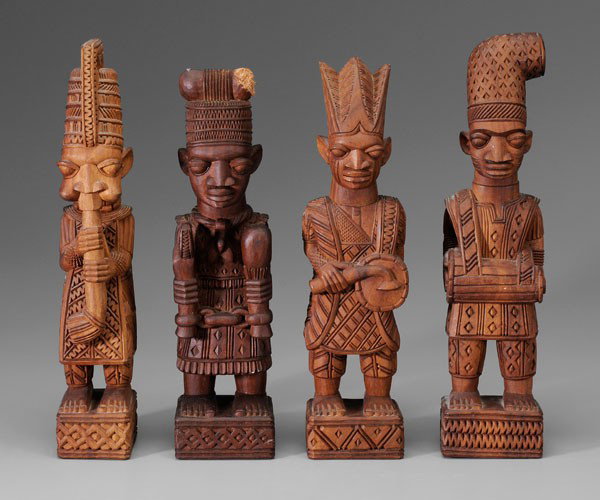 Lamidi Olonade Fakeye: (Nigerian, 1928-2009), Four Yoruba Figures, three of musicians, one possibly smoking a pipe, incised signature "L.O. Fakeye" on bottoms, carved mahoghany, 15-1/4 in. to 16-1/2 in., dog chew on hat of 
