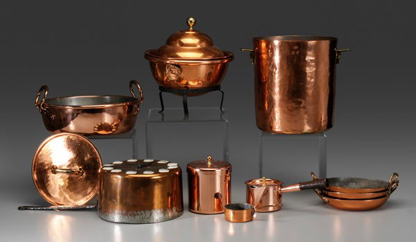Ten Pieces Copper Cookware: 19th and 20th century, lidded chafing dish with iron base, 12 in.; small saucepan, marked on bottom "Hammacher Schlemmer", 6-1/4 in.; pan with two heavy copper handles, 12-1/2 in. diameter; lid, 9 in.