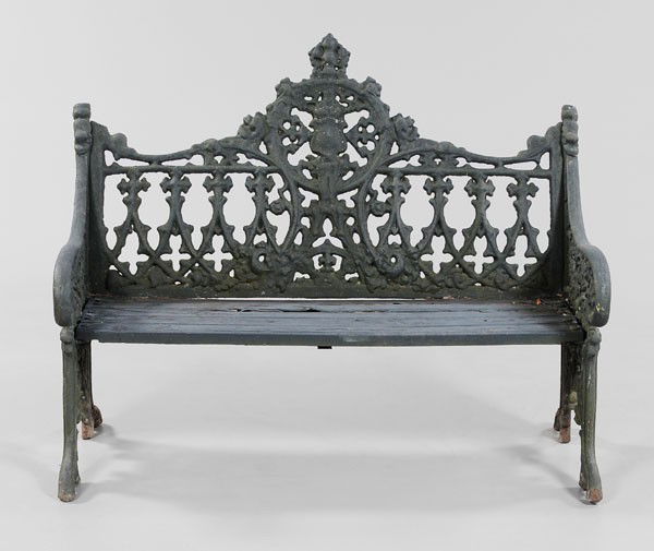 Gothic Style Cast Iron Garden Bench: American or British, late 19th/early 20th century, heavy casting with black painted surface, 37 x 48 x 25 in., wooden seat deteriorated, iron with weathering and surface corrosion, casting flaws overa