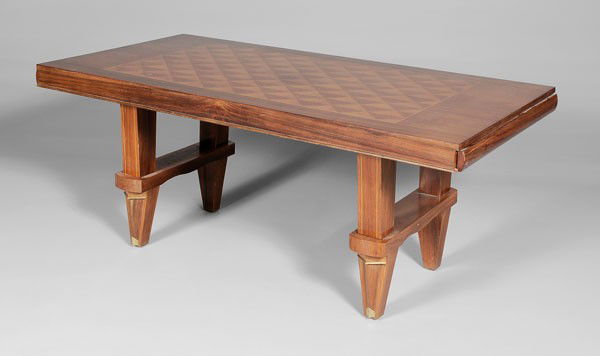 French Art Deco Library Table: attributed to Jules Leleu (French, 1882-1961), walnut top with inset checkerboard parquetry panel, two long frieze drawers, tapered legs with brass appliqués, 30 x 71 x 36 in., generally good conditi
