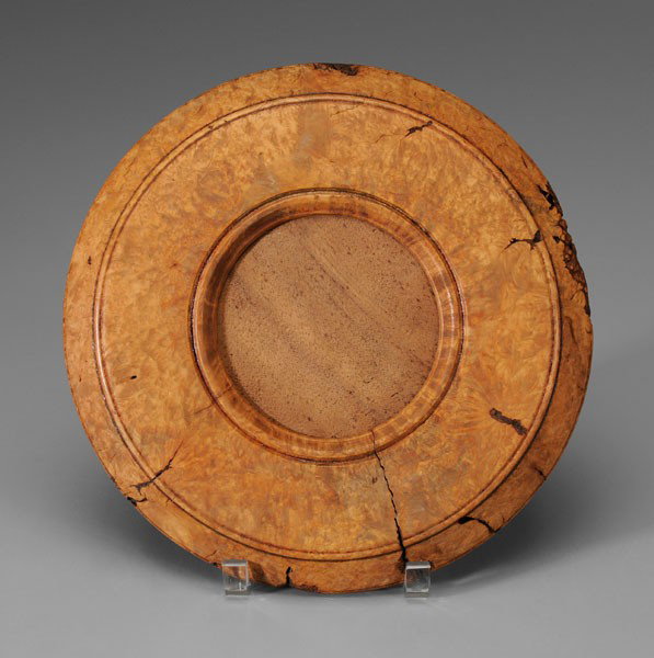 Burlwood Maple Looking Glass Frame: circular frame of highly figured maple burl, poplar backplate, 11-1/8 in., separations, other natural fissures and losses Provenance: Deaccessioned from MESDA and Old Salem to benefit the Acquisition 