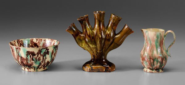 Three Pieces Tin-Glazed Earthenware: pearlware cream pitcher, probably English, late 18th century, possibly Thomas Whieldon, 5 in., [small spout chip, central body crack;] creamware bowl, purple and green glaze decoration, American or En