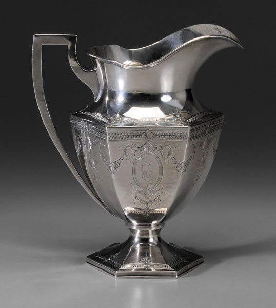 Sterling Water Pitcher: American, 20th century, paneled body with swag and bellflower engraving, marks for Black, Starr & Frost (New York City), "7707", monogram, 21.2 oz.T., 9-1/4 in., light scratches, small dents Provenanc