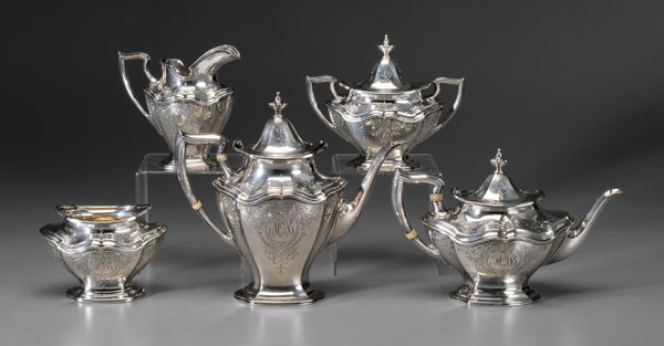 Five-Piece Sterling Tea Service: American, 20th century, marks for Reed & Barton, Hepplewhite pattern, engraved, 9-1/2 in. coffeepot with matching teapot, creamer, covered sugar, waste, creamer and waste with gilt interiors, monogram