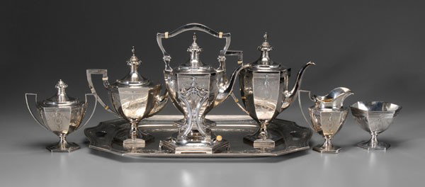 Sterling Tea Service, Matching Tray: American, 20th century: 11-1/4 in. coffeepot with matching hot water kettle, teapot, creamer, covered sugar, waste and 23-3/4 in. tray, paneled bodies with swag and bellflower engraving, urn finials, 