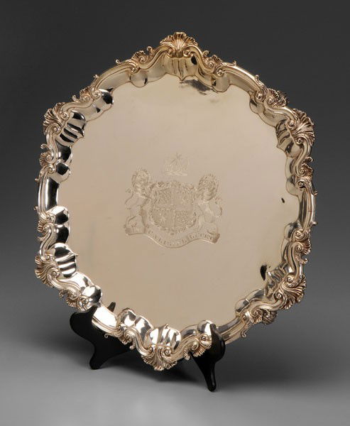 George III Irish Silver Tray: Dublin, 1764, scroll and acanthus border and feet, possibly by Thomas Jones, large engraved central heraldic device (possibly later), .925 fine, 143.39 oz.T., 23 x 23 in., lacquered surface, light scr