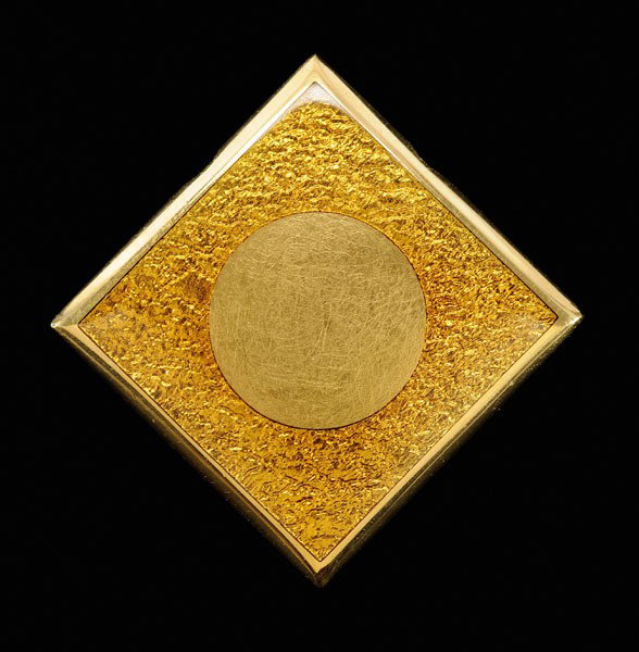 Gold and Enamel Slide/Pendant: square with raised circular center embellished with golden [basse-taille] enamel, 23 kt. yellow gold mount with marks for J. Kimmel & Co., 24.8 grams gross weight, 1-3/8 x 1-3/8 in.; insurance replace