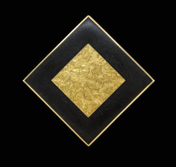 Gold and Enamel Slide/Pendant: square with raised textured central square embellished with black enamel, 23 kt. yellow gold mount with marks for J. Kimmel & Co., 40.0 grams gross weight, 1-13/16 x 1-13/16 in.; insurance replacement