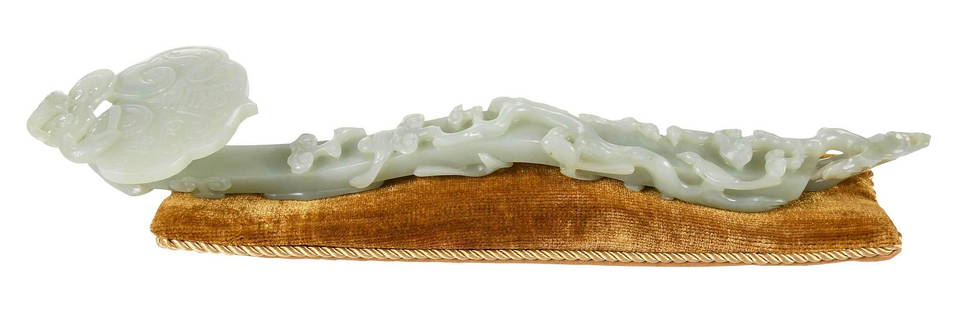 Chinese Carved Jade or Hardstone Ruyi Scepter: pale green in color with white inclusions, handle decorated in relief with birds amongst trees, top of scepter with bird and symbol, with label that reads "FL 64 64 18th Century XLP" (accessioned in