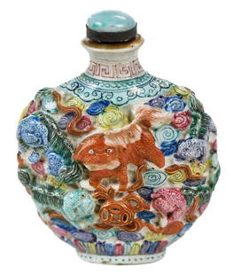 Chinese Porcelain Snuff Bottle With Foo Dogs: Qianlong reign mark on base, white ground with relief and enameled decoration of foo dogs amongst clouds with pearls, spoon with green and white finial, gilt rim and accents, 2-3/4 x 2-1/4 x 1-1/4