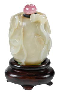 Chinese Jade or Hardstone Melon Form Snuff Bottle: pale green with inclusions, trailing leafy stems and butterfly, rose quartz finial on spoon, 2-1/4 in.Note: Tested as Jadeite on the Presidium Gem Tester II.Provenance: Charles M. Blackmon