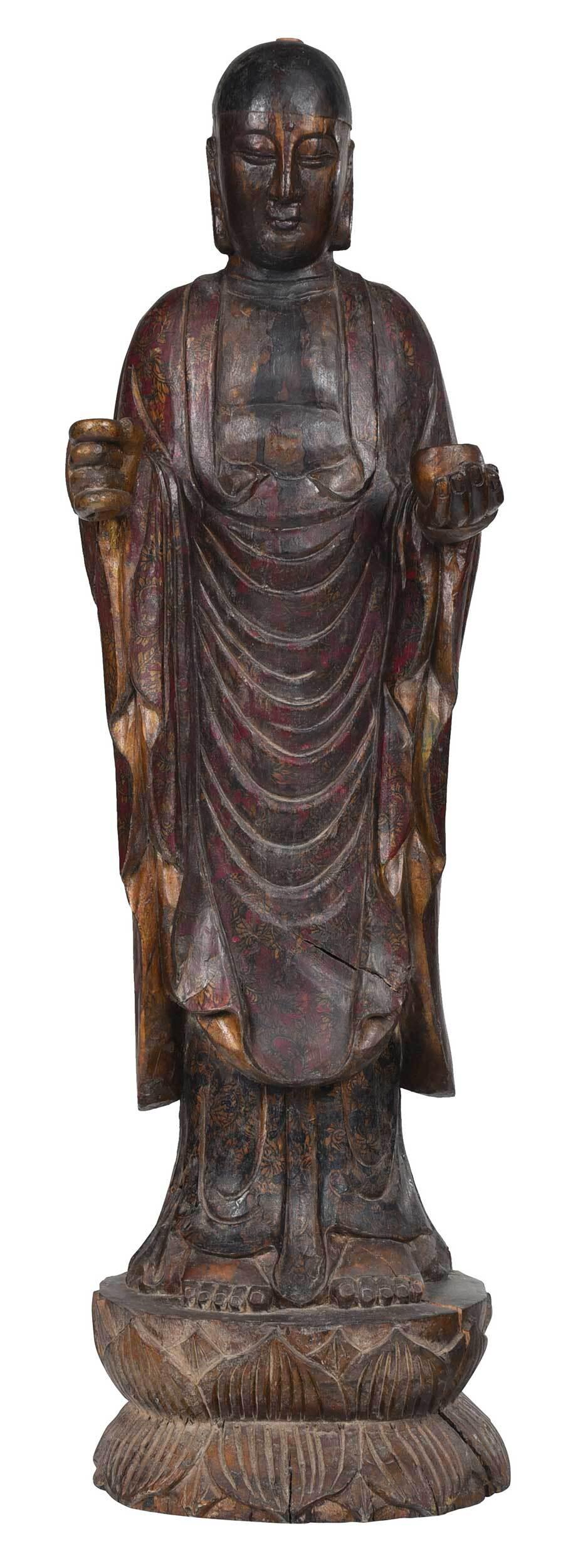 Tibetan Carved, Painted, and Gilt Wood Lohan Statue: 18th/19th century, in the form of a robed lohan/arhat, standing atop lotus base and holding a bowl, old paint in red, yellow, and black, robes with floral decoration, 36 in.
