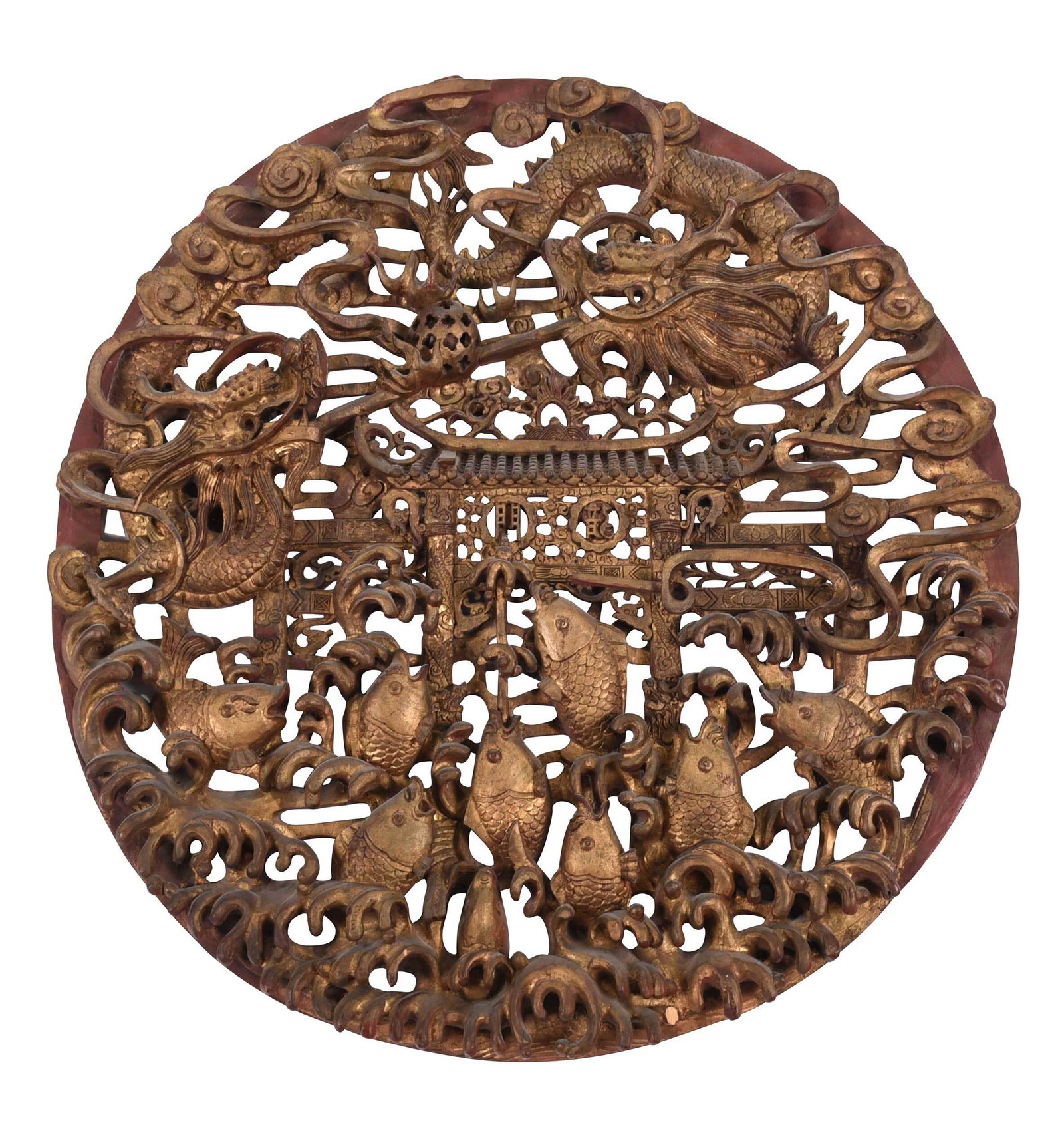 Chinese Carved and Painted Hanging Panel: circular panel elaborately carved in relief with dragons chasing pearl over central gate decoration, leaping fish and waves, red painted and gilt surfaces, 35-1/2 in. diameter Provenance: Collection o