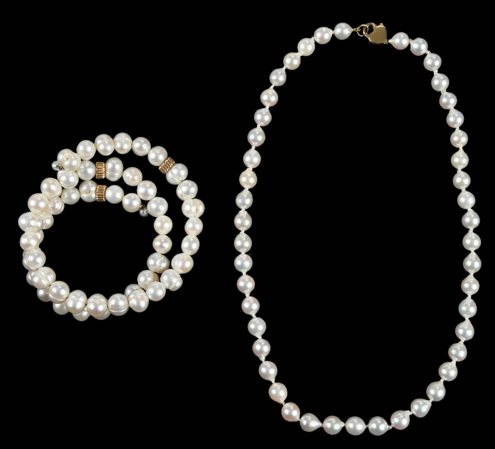 14kt. Pearl Necklace and Bracelet: necklace, knotted, baroque/irregular shaped Akoya pearls approx. 7.8mm each, clasp tested 14kt. yellow gold, 17-1/2 in. lg., 32.4 grams; bracelet, ringed baroque pearls on expandable steel wire, space