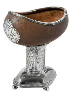 English Silver and Coconut Pedestal Bowl: London, 1926, coconut bowl with English silver mounts and pedestal base, marks for John Paul Cooper, .925 fine, 6-1/4 x 5-1/2 x 3-1/2 in. Provenance: Collection of the Birmingham Museum of Art, sold t