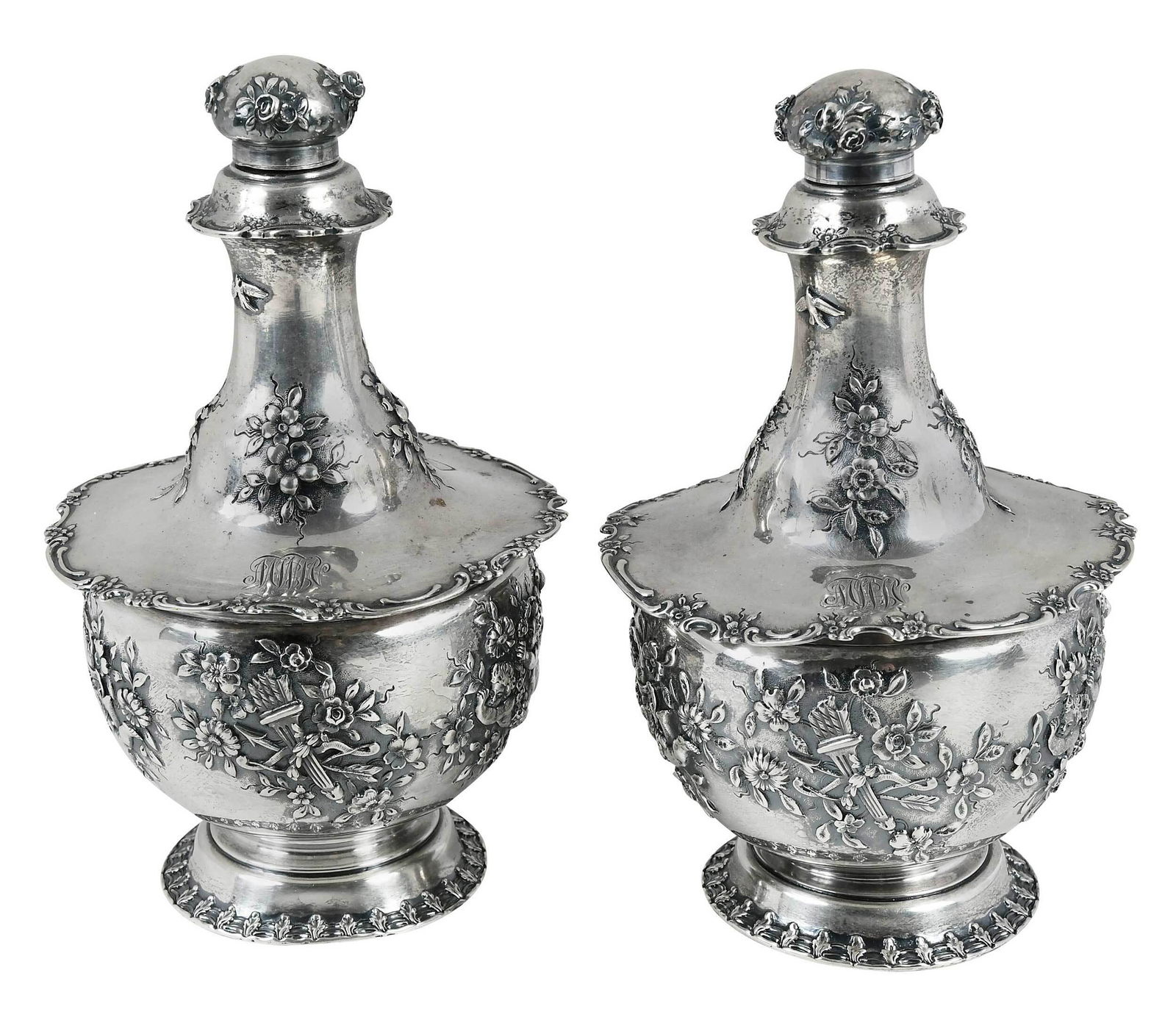Pair Tiffany Sterling Perfumes: American, 1892-1902, urn forms, with floral, birds, and trophy decoration, rotate locking lids, monograms, marks for Tiffany & Co., 28.00 oz. T., 8-3/4 in. Provenance: Winch Family, Boston, Massachuse