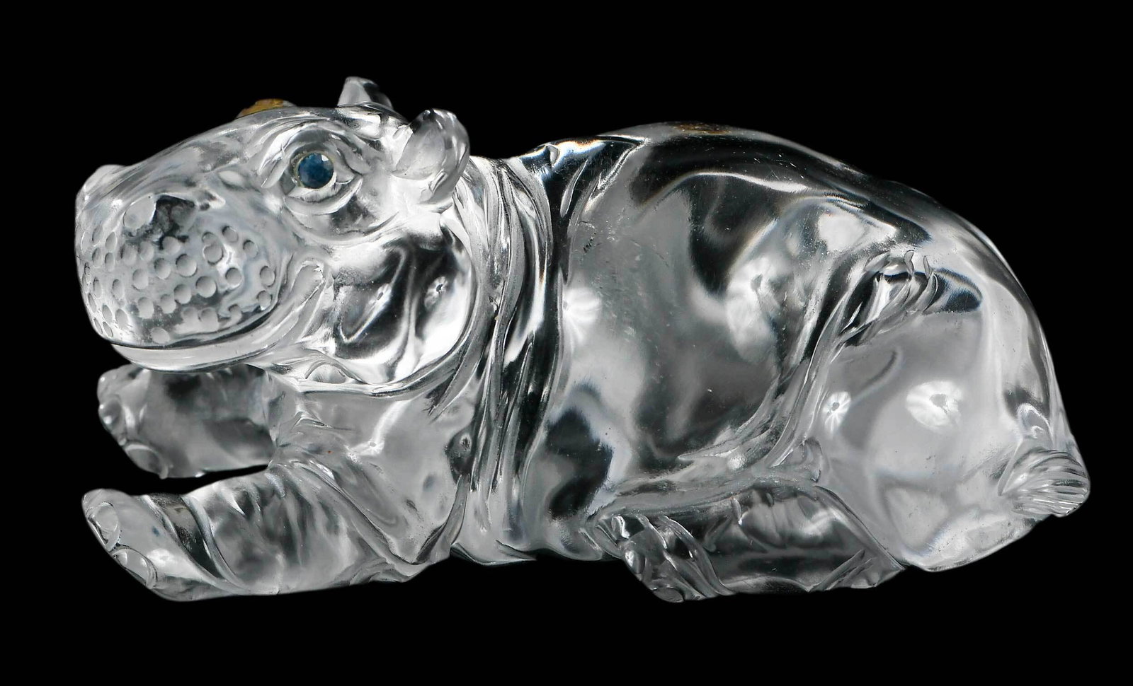 Asprey Crystal Hippopotamus with Sapphire Eyes: British, 20th century, depicted in a recumbent pose, signed "Asprey" to base, 3-1/4 in. Provenance: Estate of Sharon Mills, Chattanooga, Tennessee