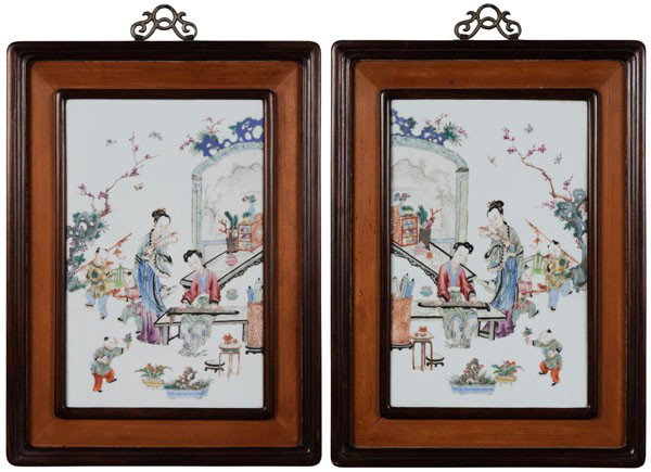 Pair Porcelain Plaques: Chinese, 20th century, mirror image, ladies in a garden, one playing a [guqin] while three boys play around them, scholars' objects set on several tables and stands, 14-3/4 x 9-1/2 in., in wood frames